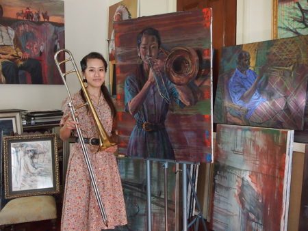 Haruka Kikuchi, with her painting by Emilie Rhys